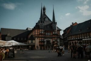 Charming old town square with historic architecture and social gathering in Wernigerode, Germany.