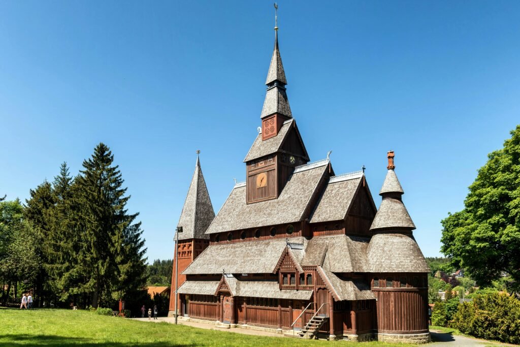 pexels-photo-25020406-25020406-2 Explore the stunning architecture of the Gustav Adolf Stave Church in Goslar, set against a clear blue sky.